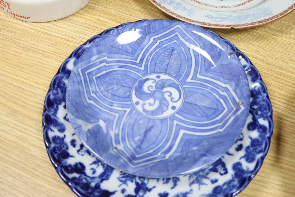 A collection of mixed Chinese and Japanese porcelain and pottery including a Nanking Cargo blue and white tea bowl, a 19th century